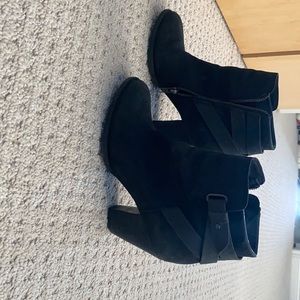 Short black booties with side zip.